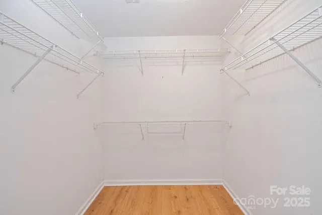 a view of a storage & utility room with dryer and washer