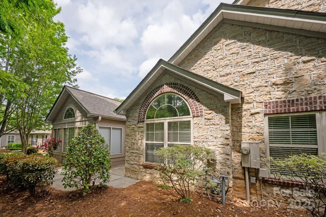 a view of a house with a yard and garage