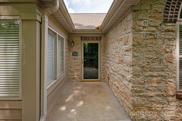 a view of a brick house with a large window