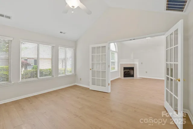 a view of an empty room with a window