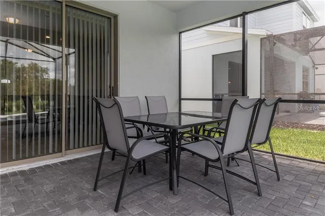 a view of a chairs and table in the balcony