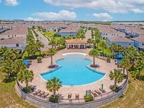 a view of a swimming pool with a patio