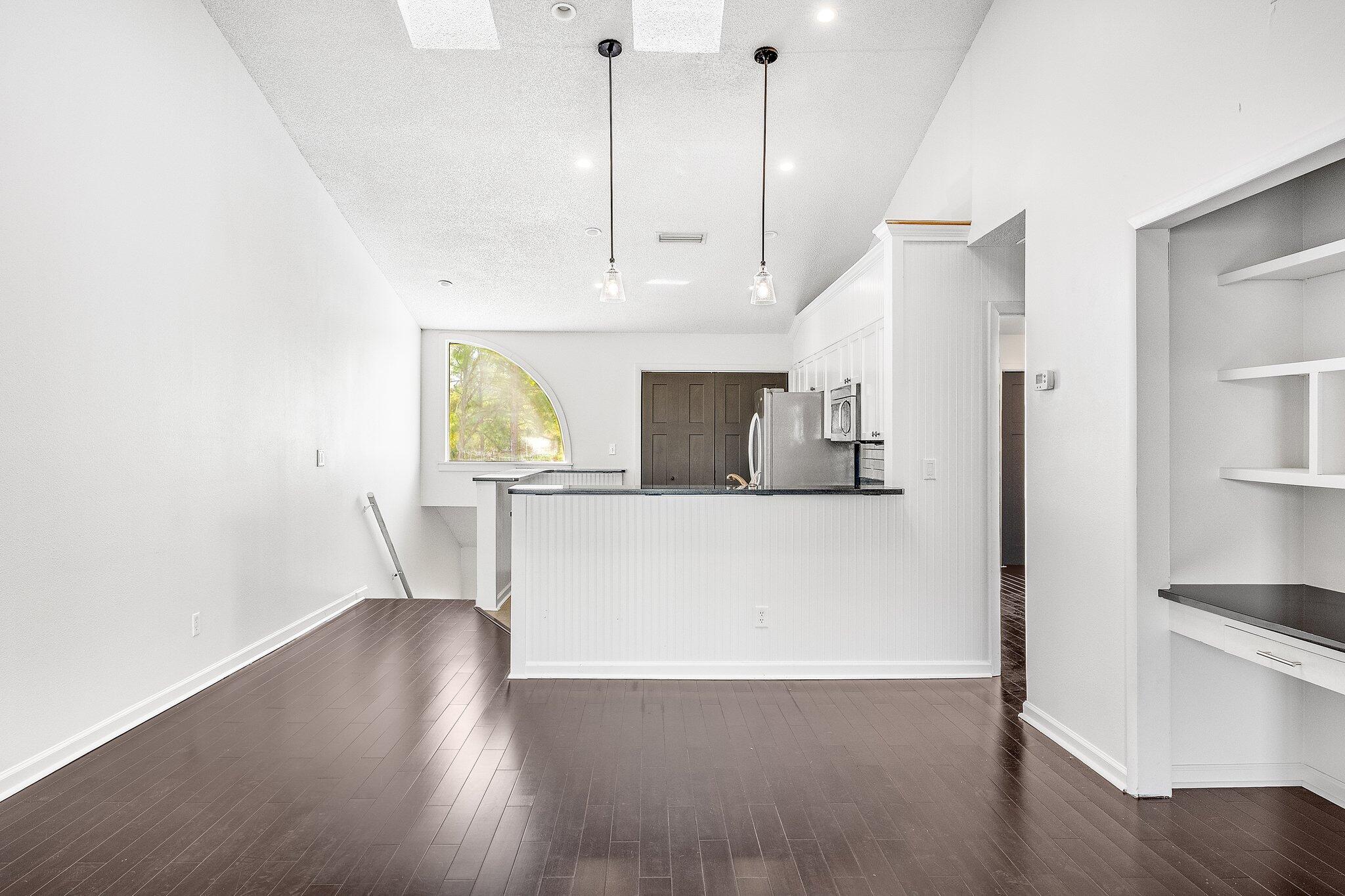 8983 Heron Walk Drive, Unit 8983 Miramar Beach, FL 32550 - Photo 13 of 57 a view of a kitchen with wooden floor and electronic appliances