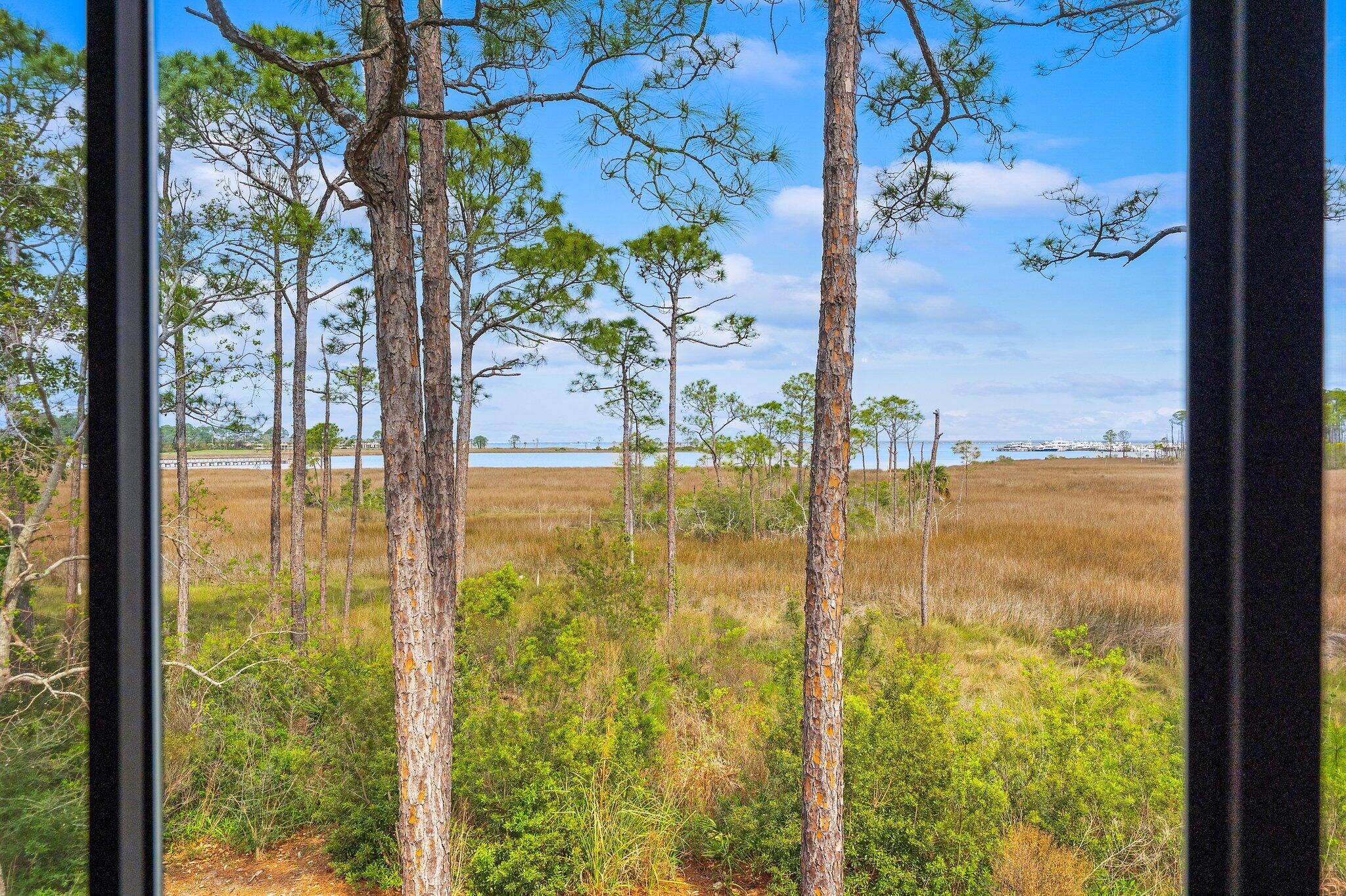 8983 Heron Walk Drive, Unit 8983 Miramar Beach, FL 32550 - Photo 18 of 57 a view of a glass door with a lake view