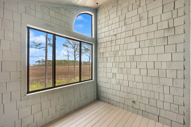 a view of a swimming pool with a yard and ocean view