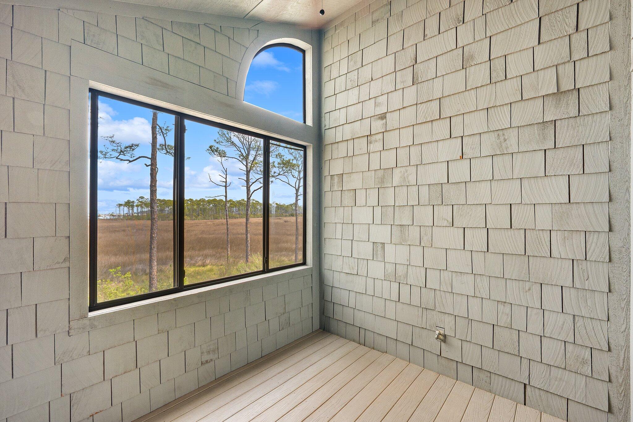 8983 Heron Walk Drive, Unit 8983 Miramar Beach, FL 32550 - Photo 27 of 57 a view of empty room with wooden floor and fan