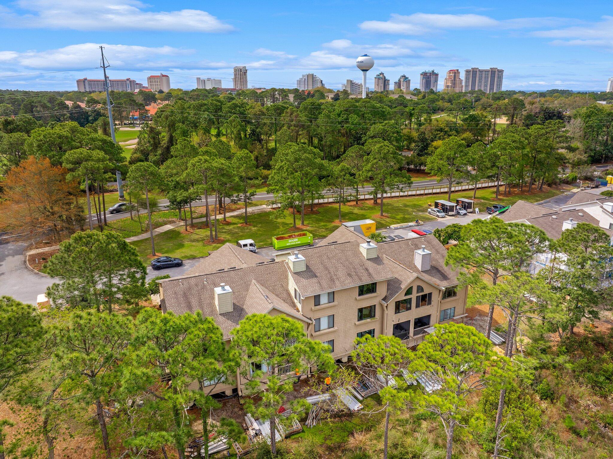 8983 Heron Walk Drive, Unit 8983 Miramar Beach, FL 32550 - Photo 29 of 57 a view of a swimming pool with a yard and ocean view