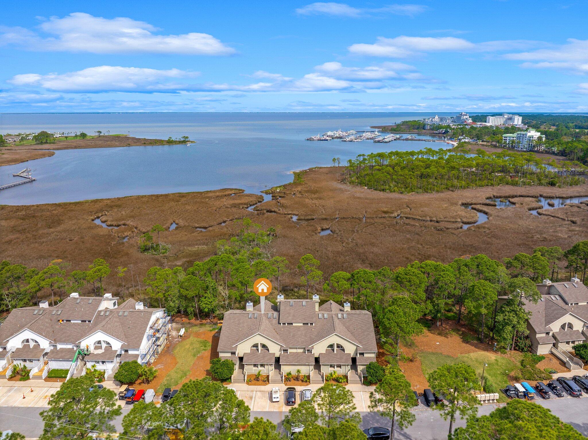 8983 Heron Walk Drive, Unit 8983 Miramar Beach, FL 32550 - Photo 31 of 57 an aerial view of ocean and residential houses with outdoor space
