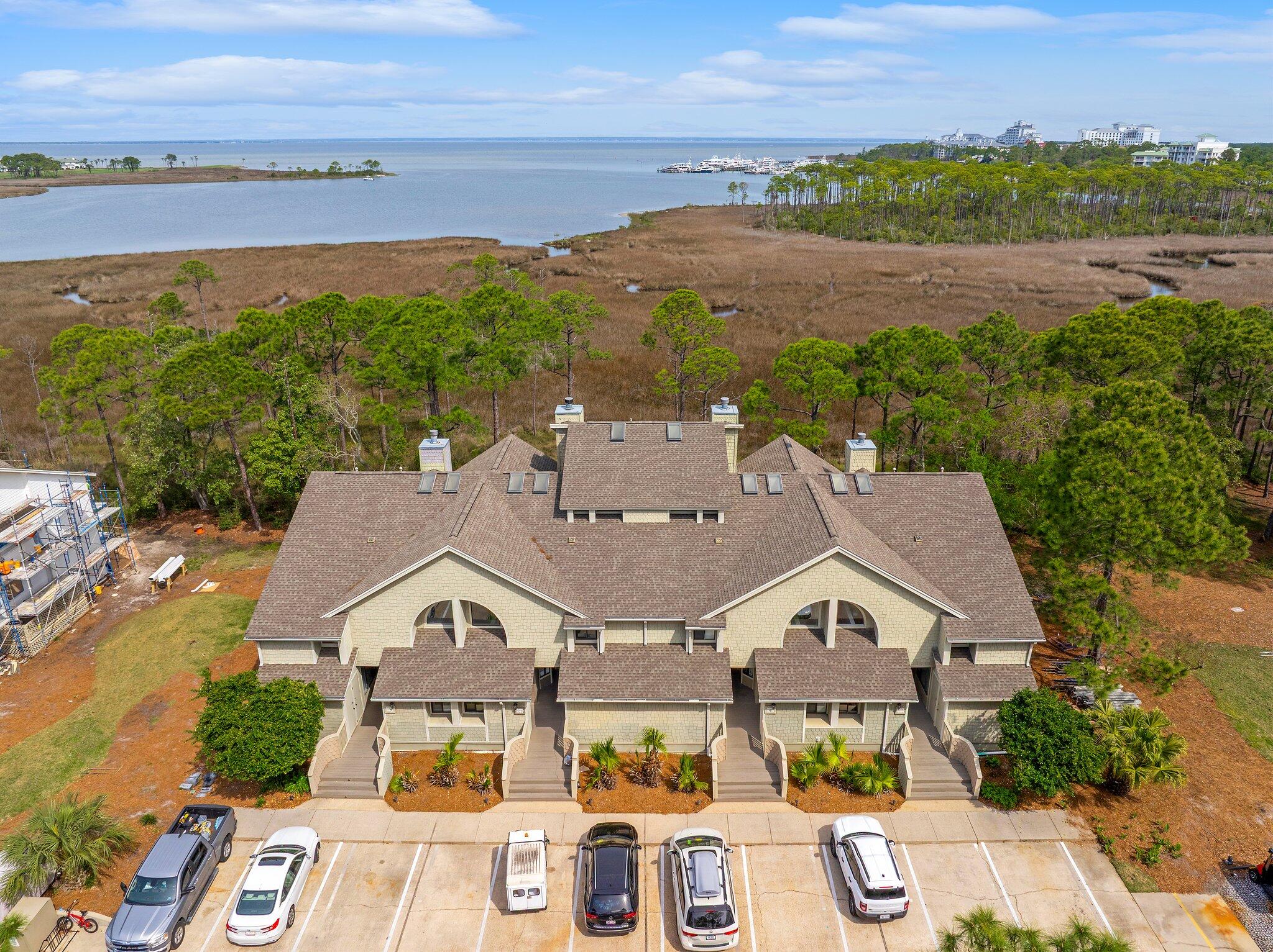8983 Heron Walk Drive, Unit 8983 Miramar Beach, FL 32550 - Photo 32 of 57 an aerial view of a house with a garden and lake view