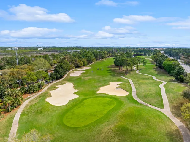 a view of a balcony with an outdoor space and seating area