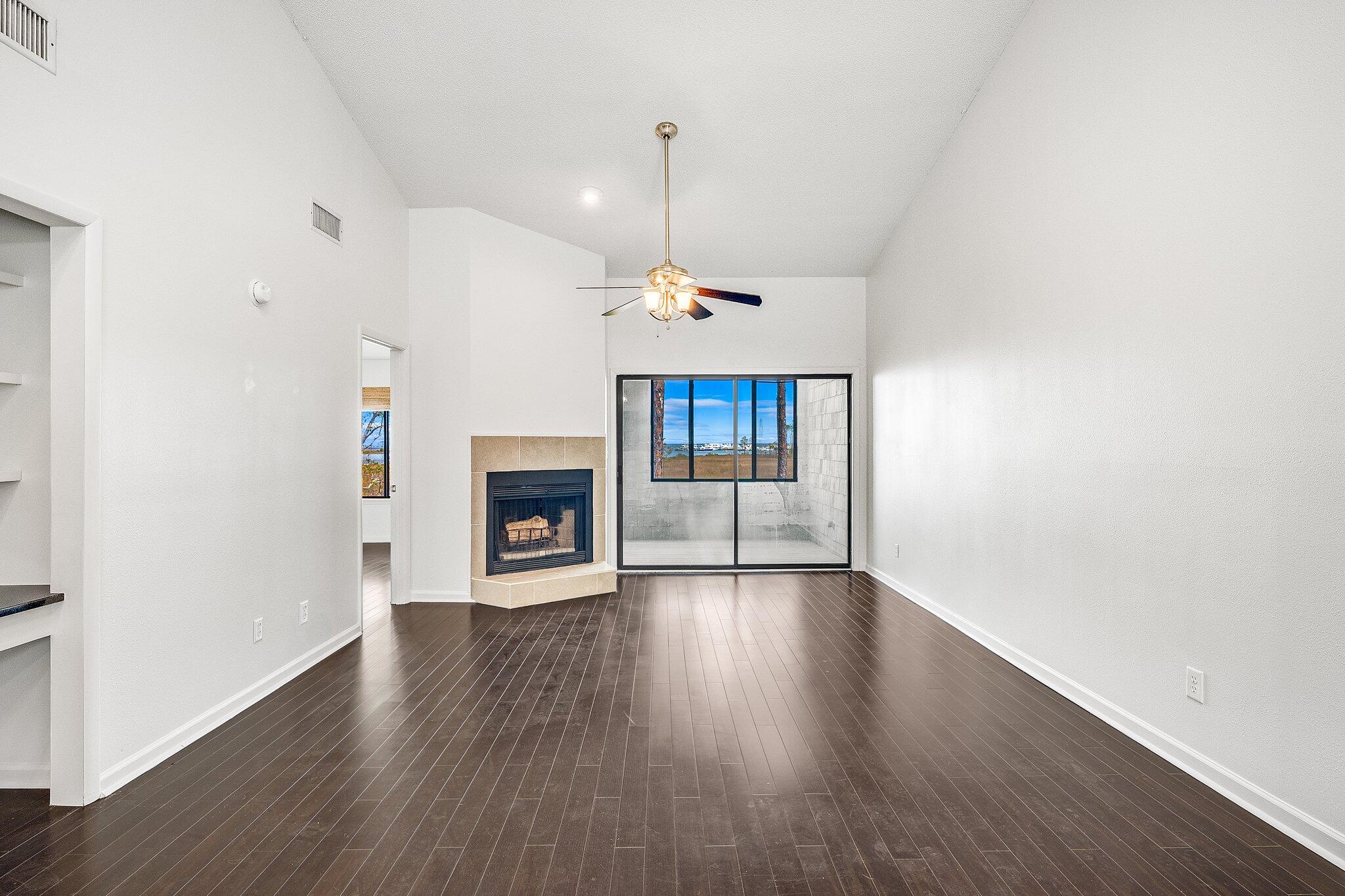 8983 Heron Walk Drive, Unit 8983 Miramar Beach, FL 32550 - Photo 8 of 57 a view of a room with window and wooden floor