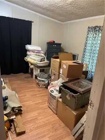 a view of a living room and bathroom with a bathtub
