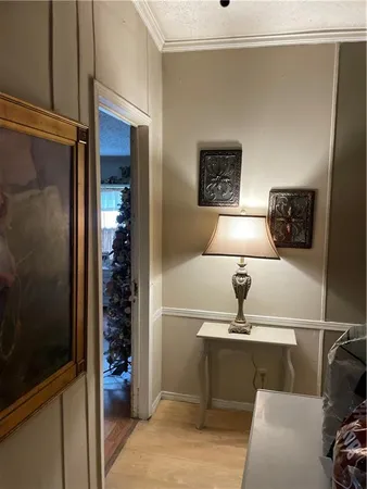 a living room with furniture gym equipment and a window