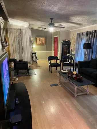 a dining room with furniture and wooden floor
