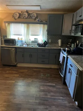 a view of a storage & utility room with a sink