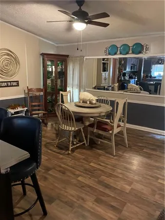 a bedroom with a bed and a mirror