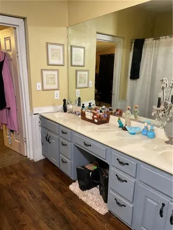 a bathroom with a window and a shower