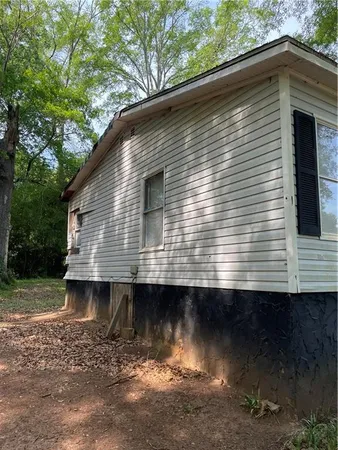 a view of a yard with large trees