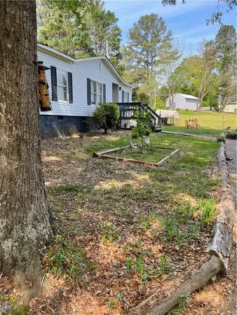 a view of a field with a big yard