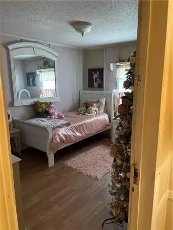 a bedroom with bed and a window