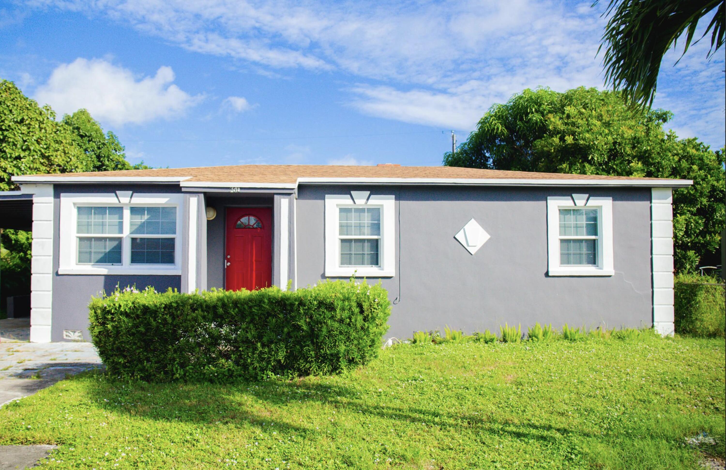 front view of a house with a yard