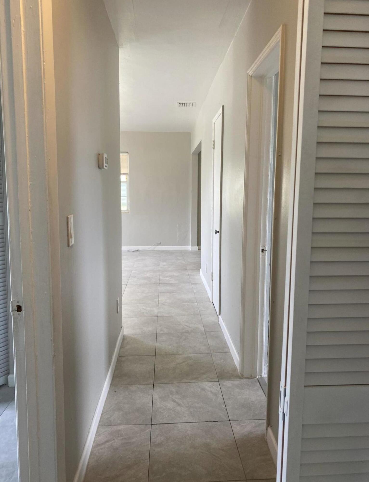 360 West 27th Street Riviera Beach, FL 33404 - Photo 5 of 5 a view of a hallway