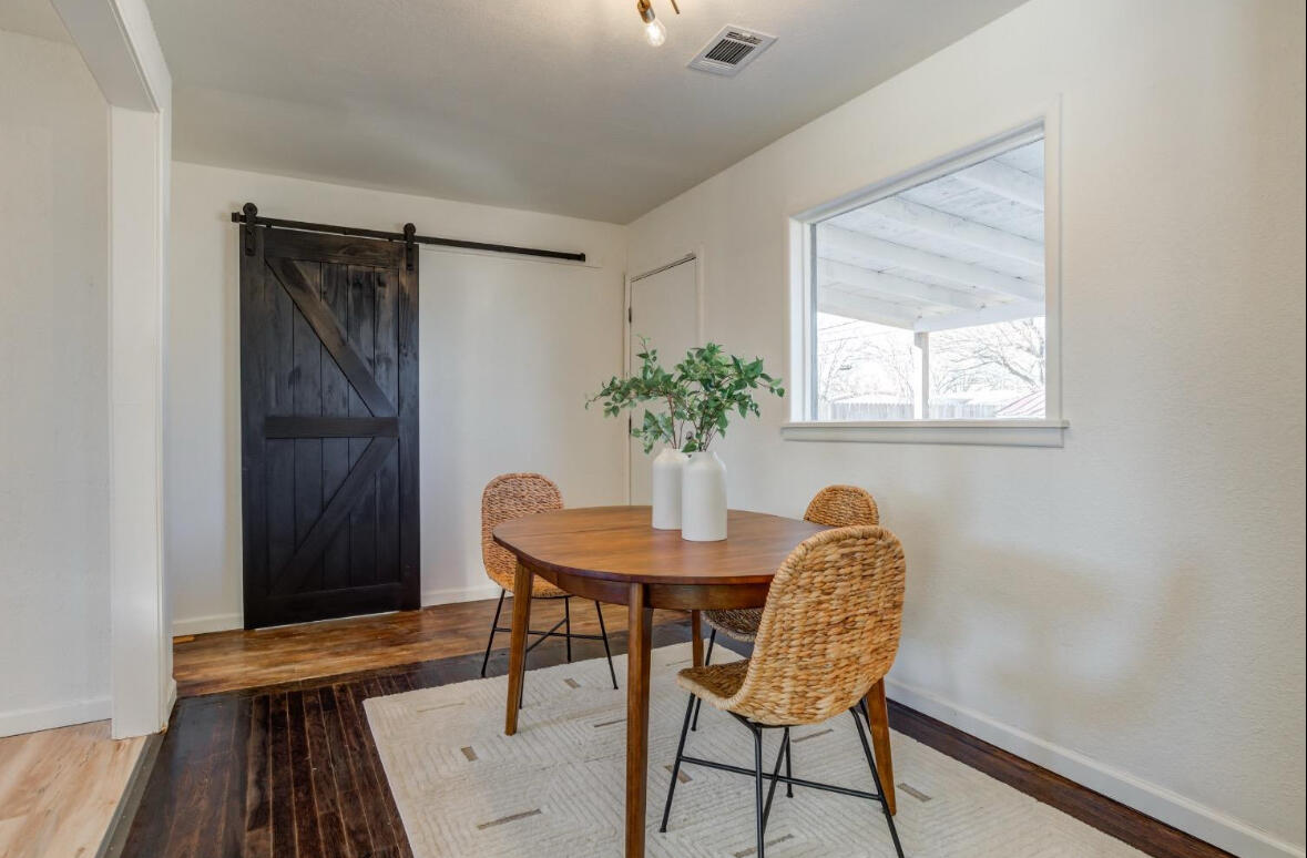 3812 31st Street Lubbock, TX 79410 - Photo 12 of 16 a dining room with furniture and wooden floor