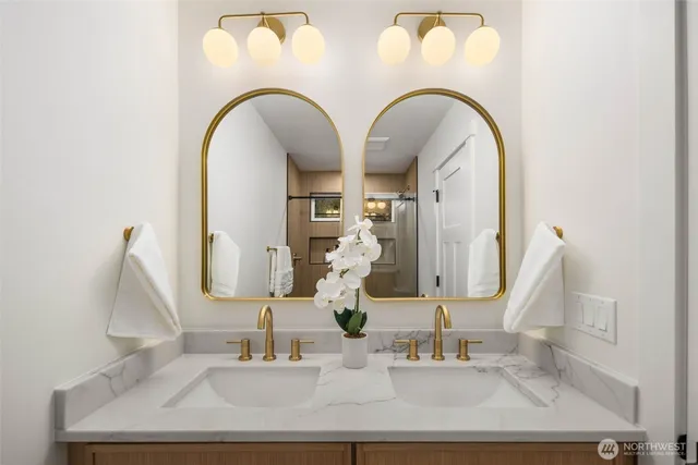 a close view of light fixtures and kitchen sink