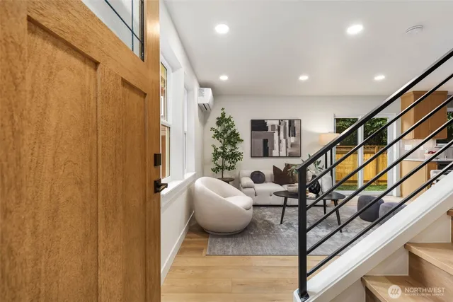 a living room with furniture and a chandelier