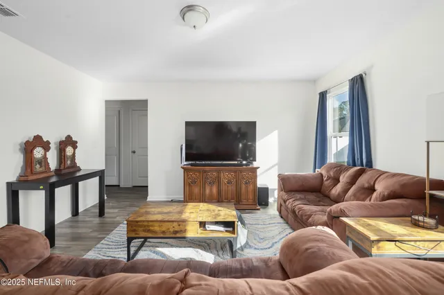 a spacious bedroom with a bed and window