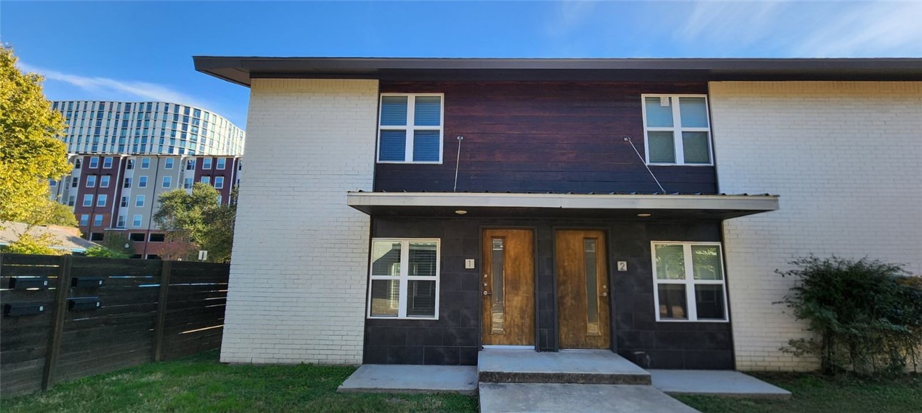 505 Boyett Street, Unit D1 College Station, TX 77840 - Photo 1 of 23 a view of a house with many windows and plants