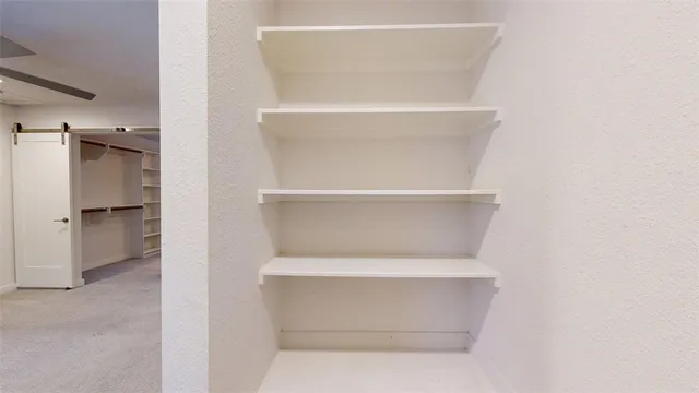 a view of an empty walk in closet