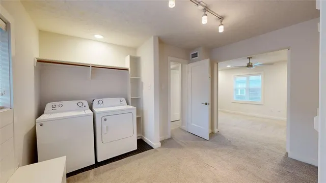 a view of storage and utility room with washer and dryer