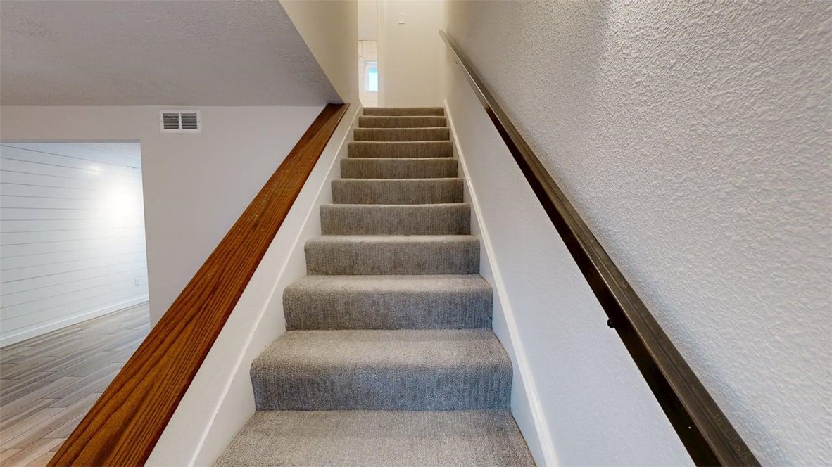 505 Boyett Street, Unit D1 College Station, TX 77840 - Photo 9 of 23 a view of staircase with white walls