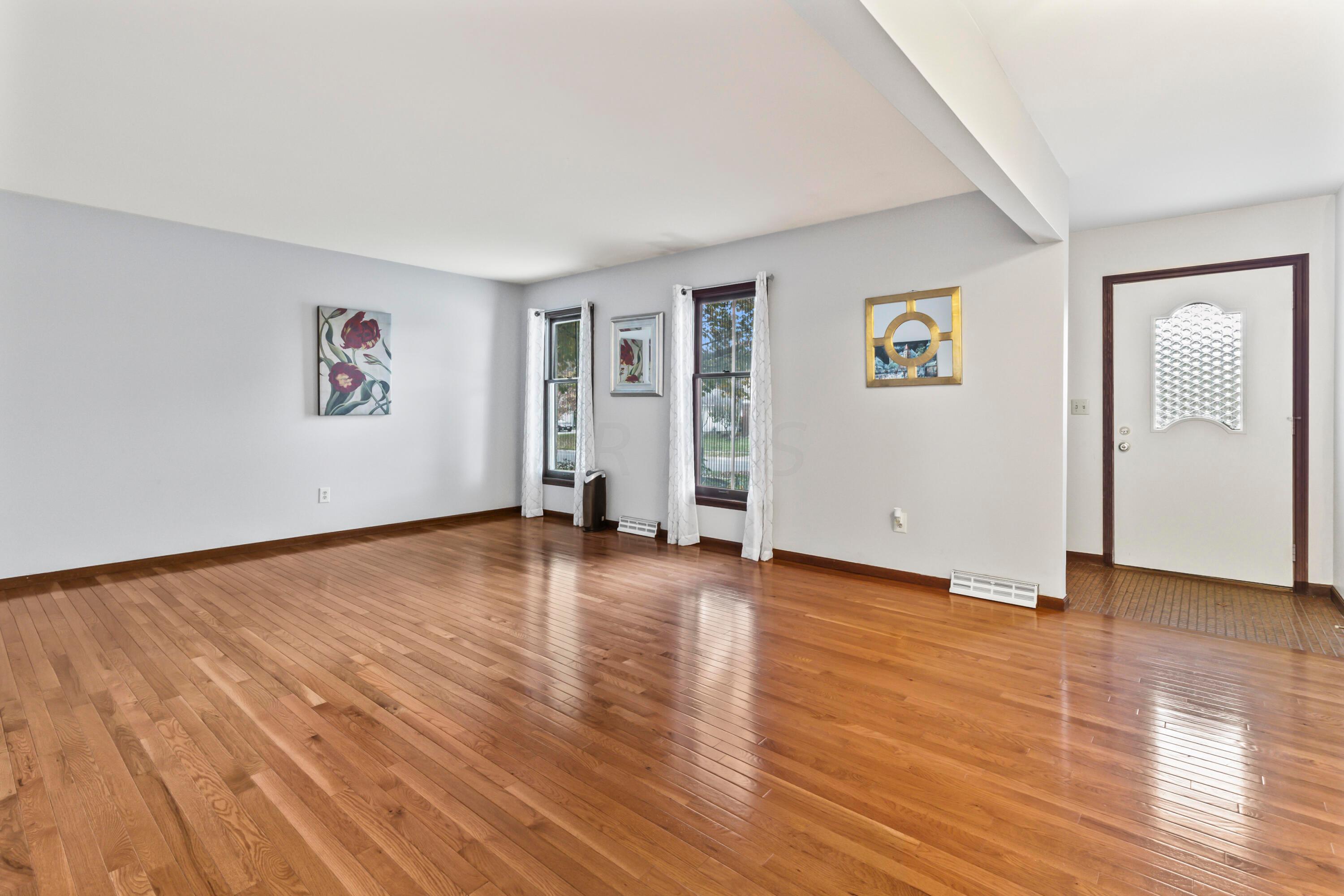 7020 Rieber Street Columbus, OH 43085 - Photo 6 of 40 • New hardwood flooring ~ 2012 • Grey painted walls • Drapes are negotiable