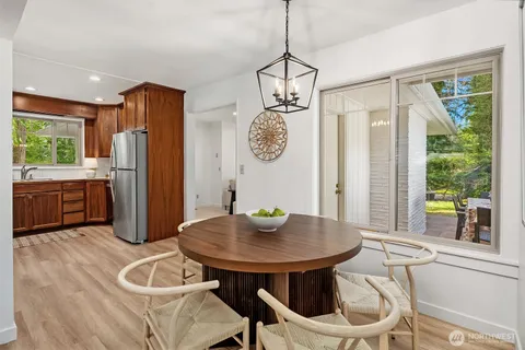 a view of a dining room with furniture window and outside view