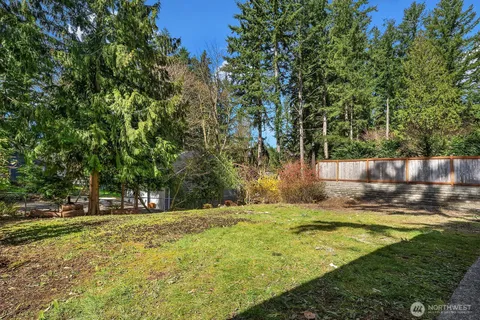 a swimming pool with wooden fence
