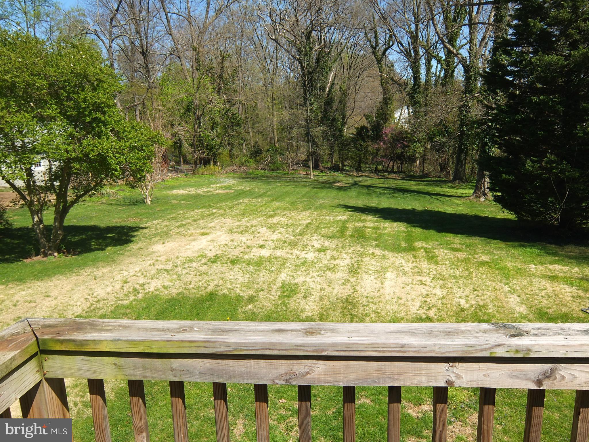 249 Gralan Road Baltimore, MD 21228 - Photo 3 of 25 a view of a yard with wooden fence