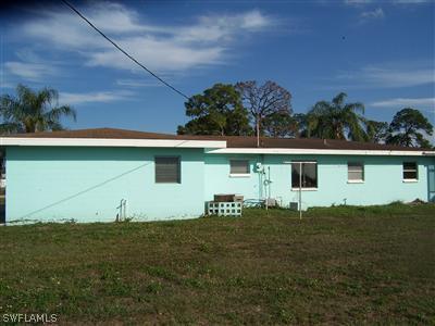 109 Delaware Road Lehigh Acres, FL 33936 - Photo 10 of 10 a view of a backyard