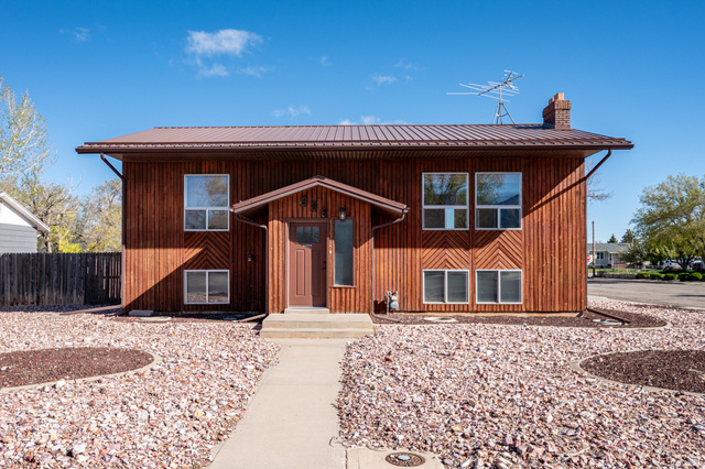 386 West Frontier Circle Cedar City, UT 84721 - Photo 1 of 1 View of front of home featuring a chimney