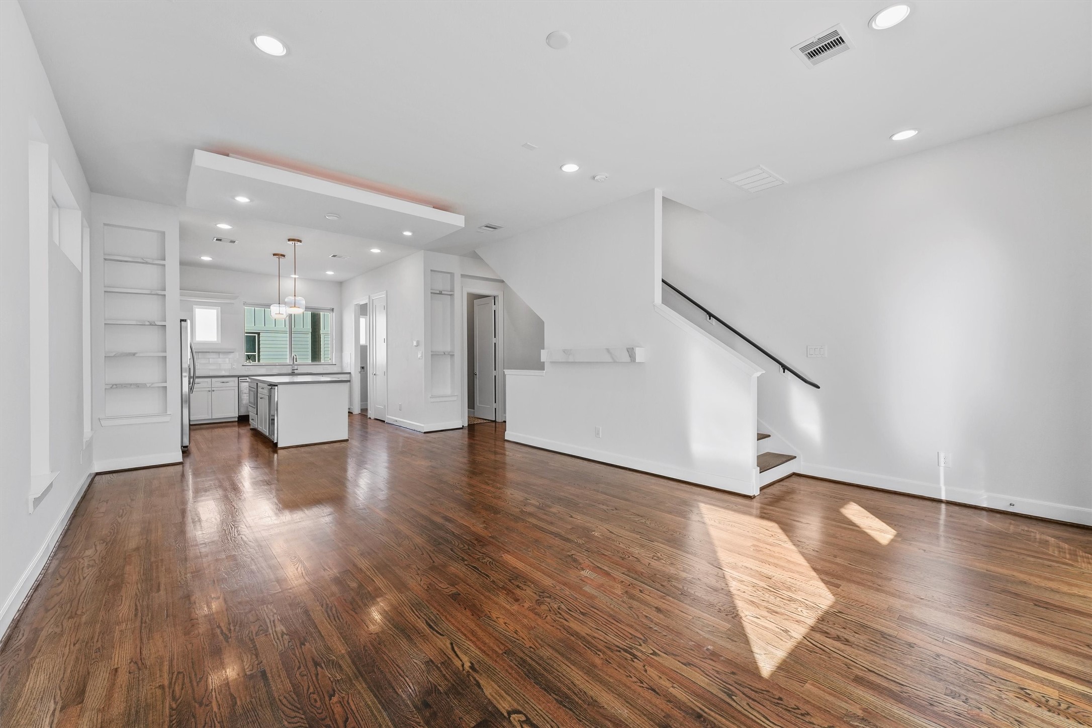 1050 Timbergrove Yards Lane Houston, TX 77008 - Photo 12 of 33 a view of a big room with wooden floors and kitchen view