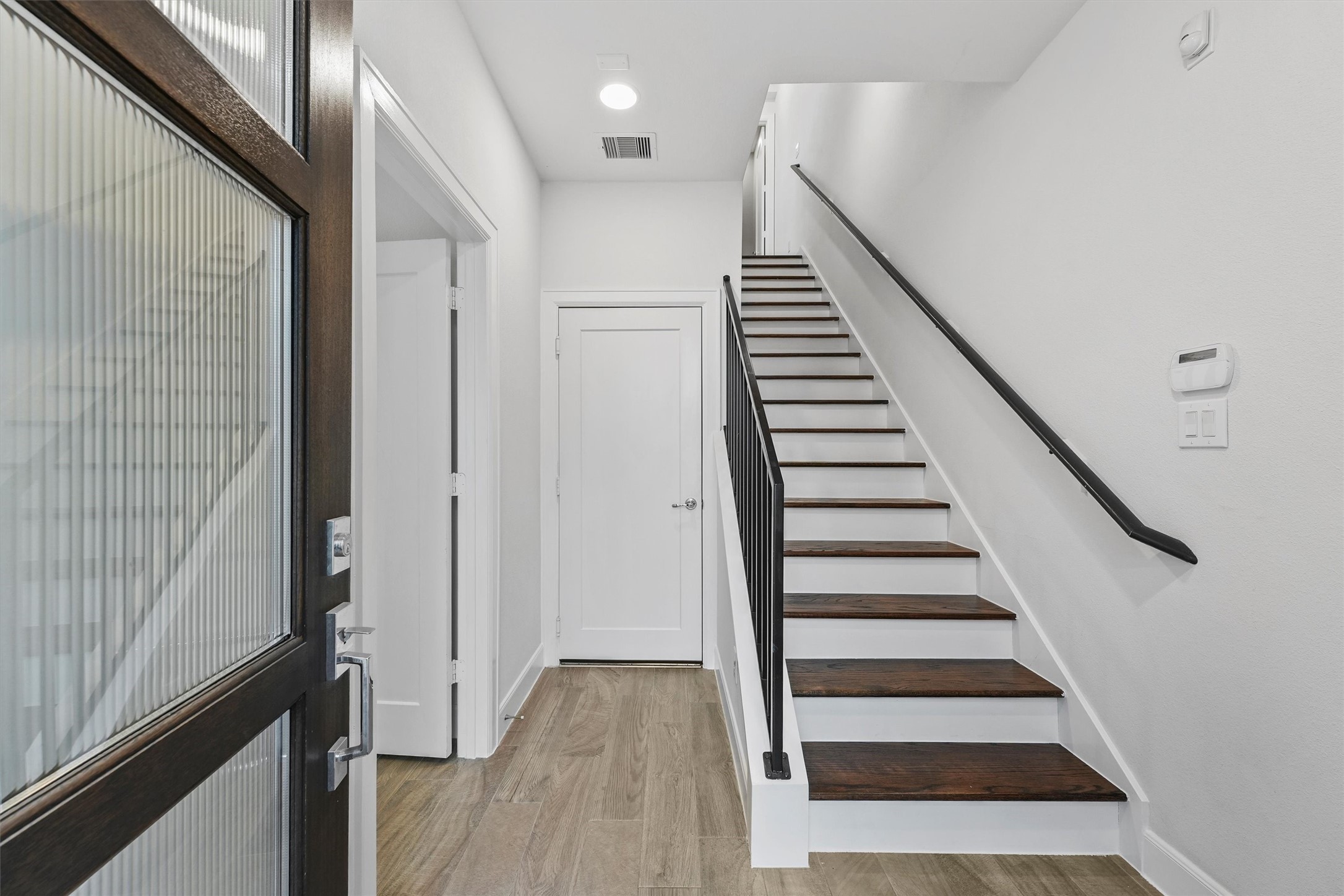 1050 Timbergrove Yards Lane Houston, TX 77008 - Photo 4 of 33 a view of a hallway with wooden floor and entryway