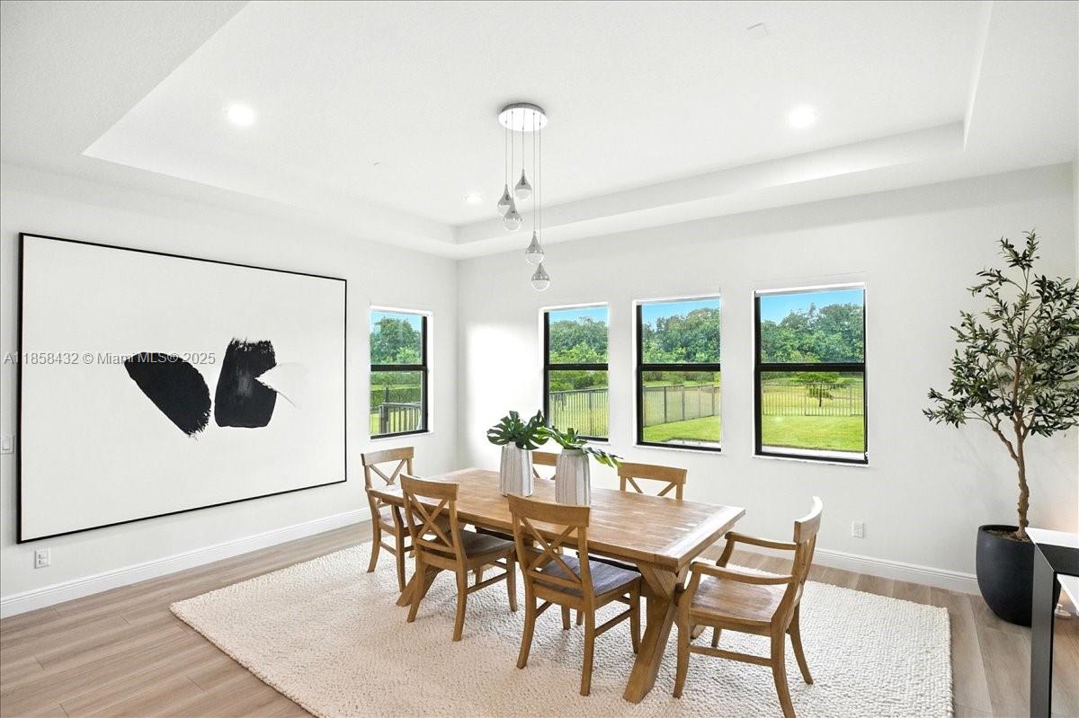 17819 Southwest 58th Street Southwest Ranches, FL 33331 - Photo 17 of 56 a dining room with furniture and window
