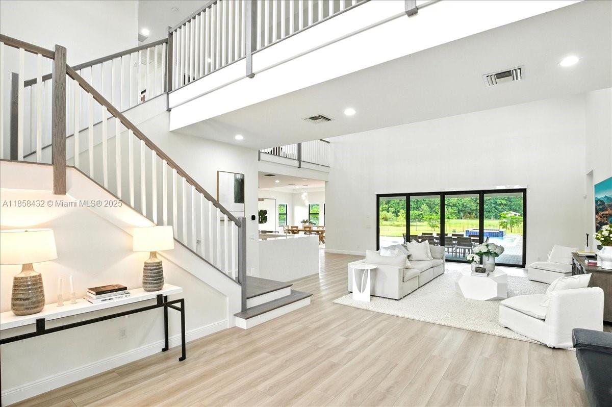 17819 Southwest 58th Street Southwest Ranches, FL 33331 - Photo 2 of 56 a view of entryway and hall with wooden floor