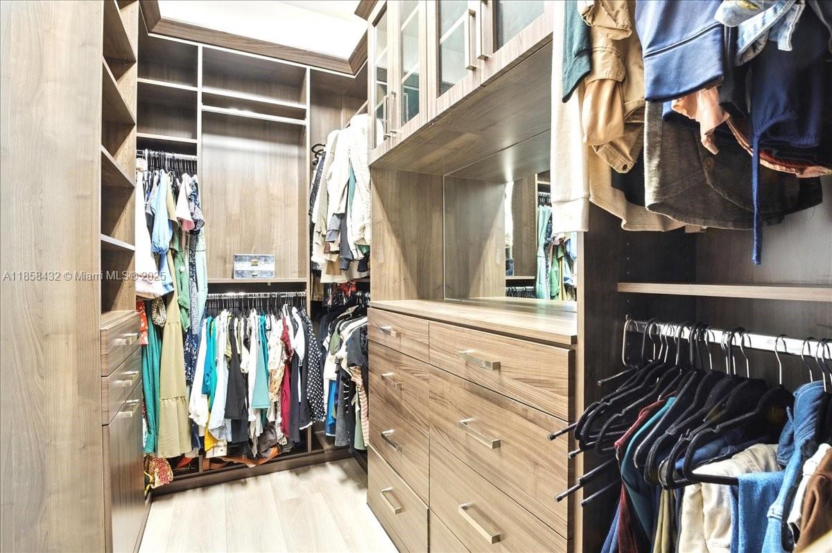 17819 Southwest 58th Street Southwest Ranches, FL 33331 - Photo 27 of 56 a view of walk in closet with clothes and shoes