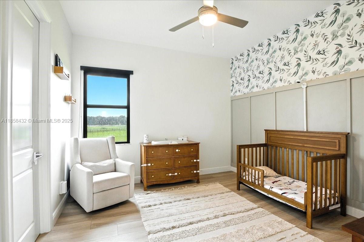 17819 Southwest 58th Street Southwest Ranches, FL 33331 - Photo 29 of 56 a bedroom with a bed and a couch