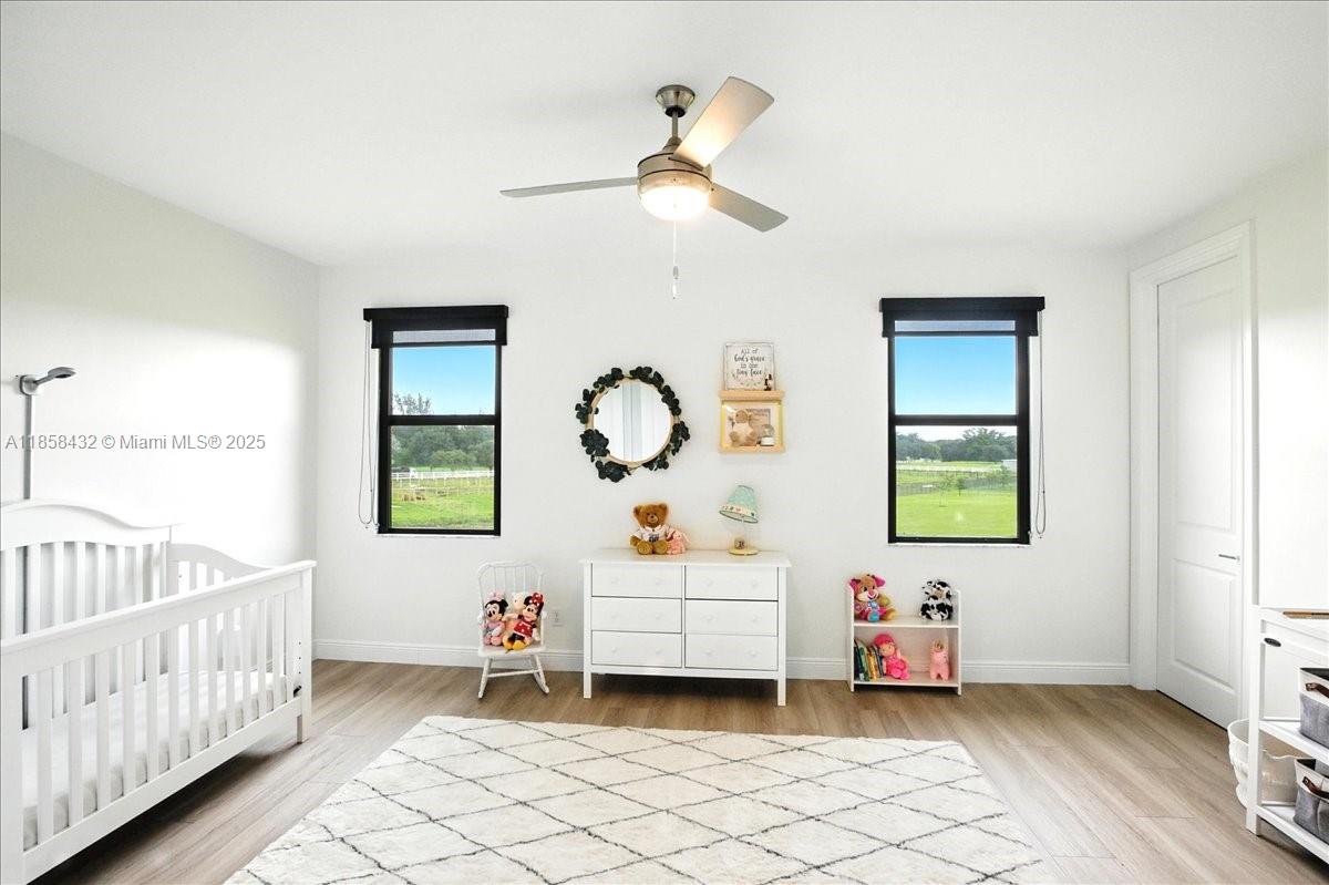 17819 Southwest 58th Street Southwest Ranches, FL 33331 - Photo 38 of 56 a bedroom with a bed and window