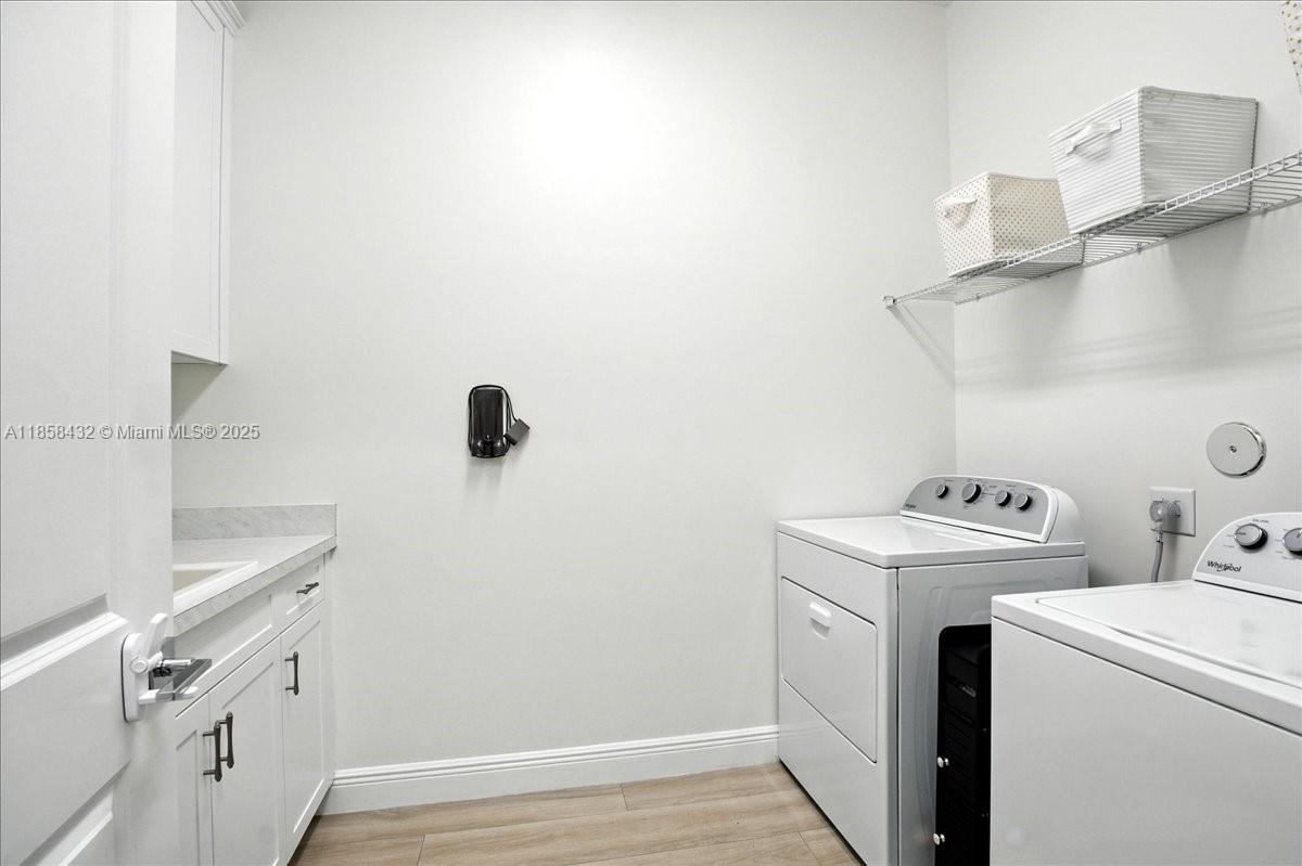 17819 Southwest 58th Street Southwest Ranches, FL 33331 - Photo 41 of 56 a view of storage and utility room with washer and dryer