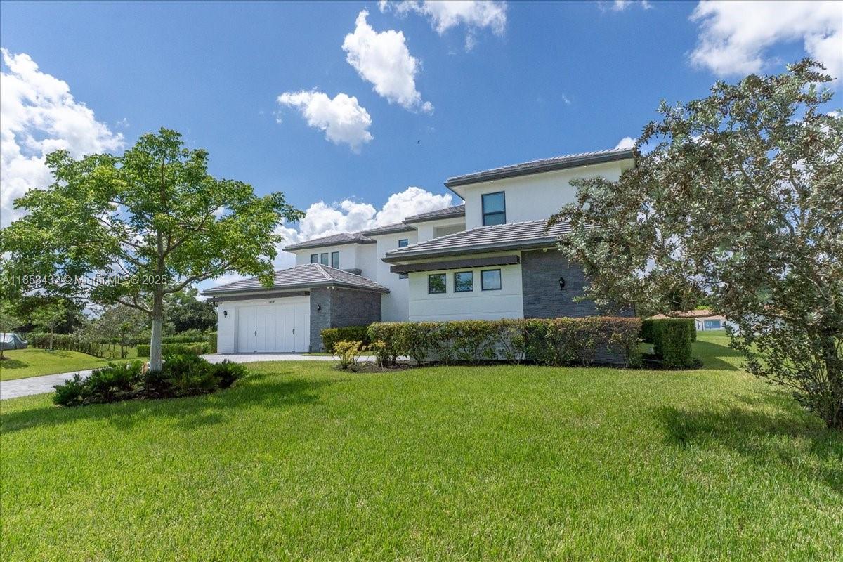 17819 Southwest 58th Street Southwest Ranches, FL 33331 - Photo 44 of 56 a view of a house with a yard