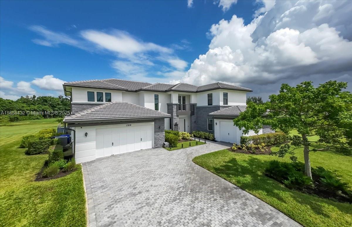 17819 Southwest 58th Street Southwest Ranches, FL 33331 - Photo 46 of 56 a front view of a house with garden